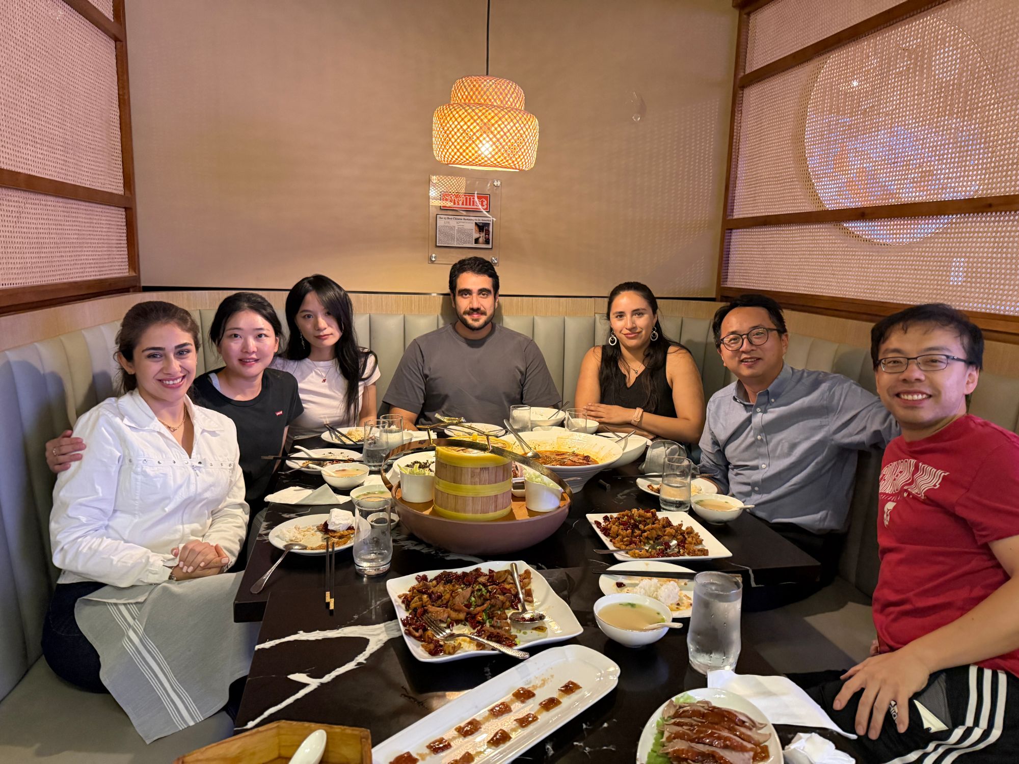 Jiang Lab members at a group dinner during SE3 2026